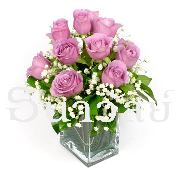 12 violet roses in a glass vase