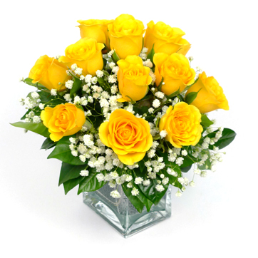 12 yellow rose in a glass vase